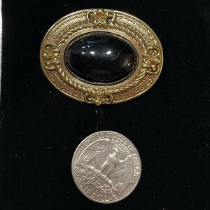 Vintage 1928 Gold and Black Brooch